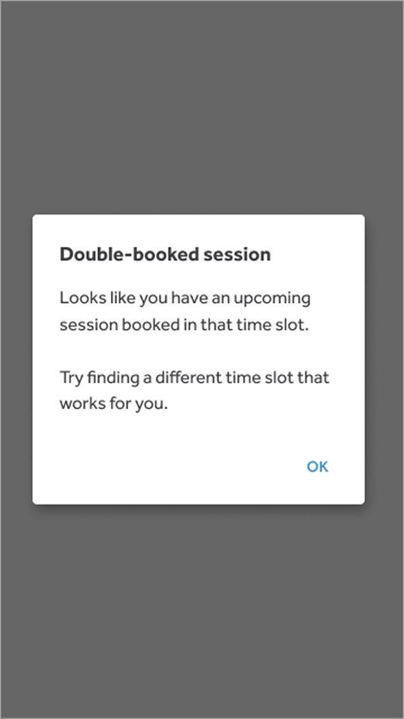 Mobile modal titled Double-booked session. Body reads: Looks like you have an upcoming session booked in that time slot. Try finding a different time slot that works for you. An OK button sits at the bottom right.